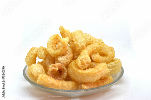 Pork cracklings on white background for traditional north Thai food concept.
