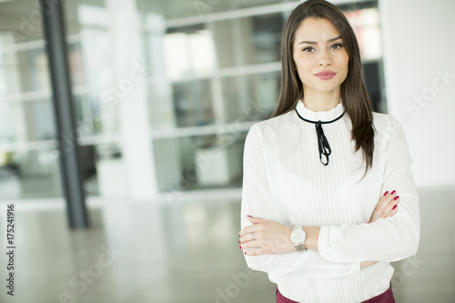 Young businesswoman standing in modern office