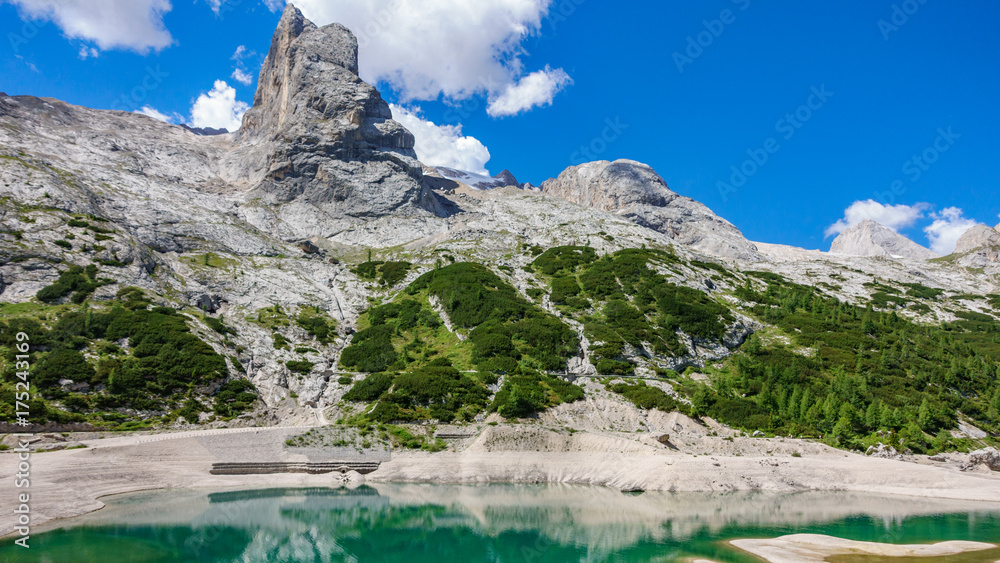 Obraz premium Glacial lake with clear cold water. Lago di Fedaia, Dolomites