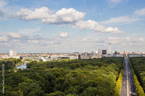 Cityscape of Berlin and road in Tiergarten park landscape