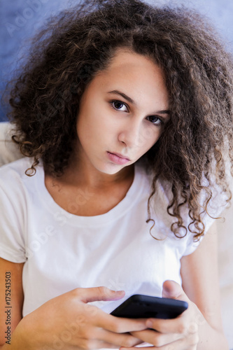 Curly hair teenage girl wit...