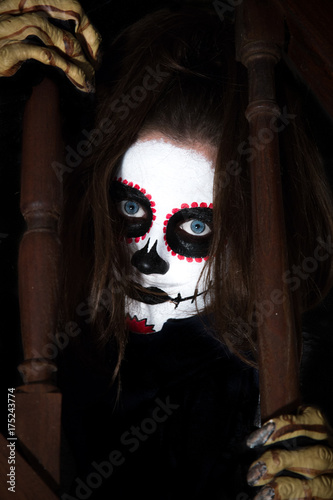 Halloween - Terrifiying Portrait of a zombie girl - Red, black and white make up - black background
