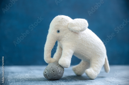 Photography Handmade toy white elephant with gray stone