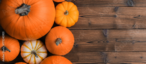 Pumpkins on wooden background