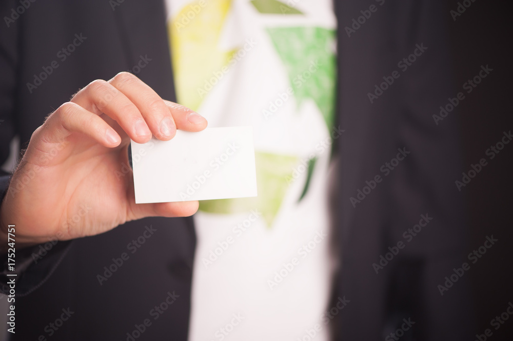 Reduce Reuse Recycle. Businessman Holding A White Card With Text Reduce Reuse Recycle. Businessman Holding A White Card With Text