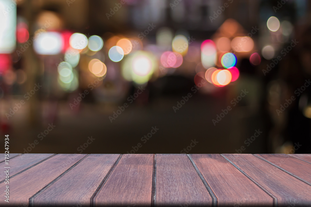 Wooden table over blurred colorful background, abstract ,presentation