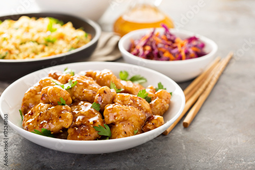 Spicy sweet and sour chicken with rice and cabbage