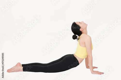 attractive beautiful woman practicing yoga in upward-facing dog pose on white background. healthy care concept.