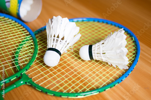 Close up shuttlecocks on racket badmintons at badminton courts