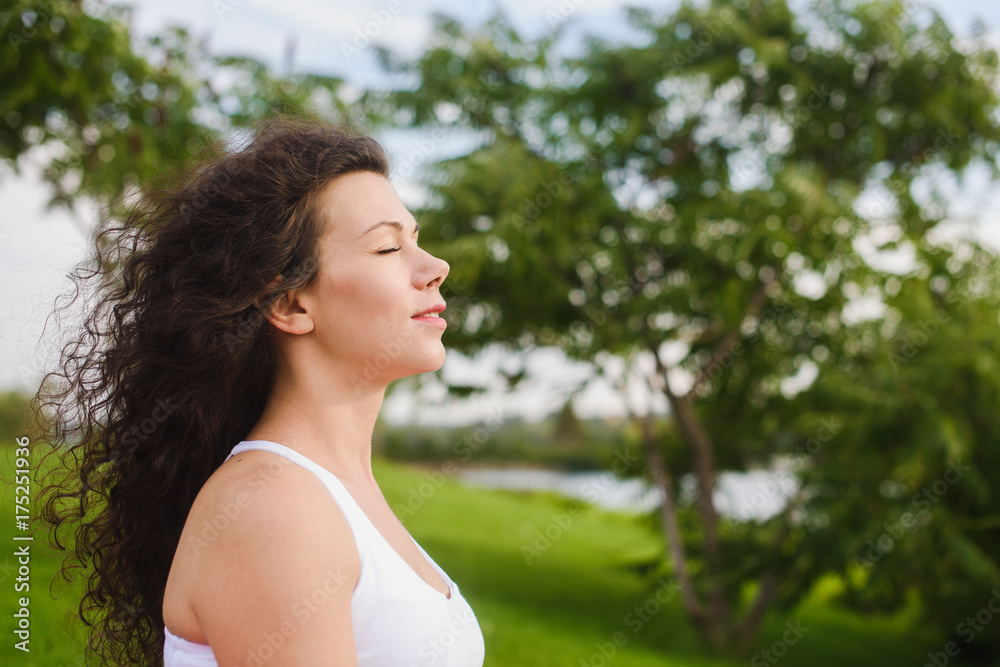 Woman meditating with her eyes closed Woman meditating with her eyes closed