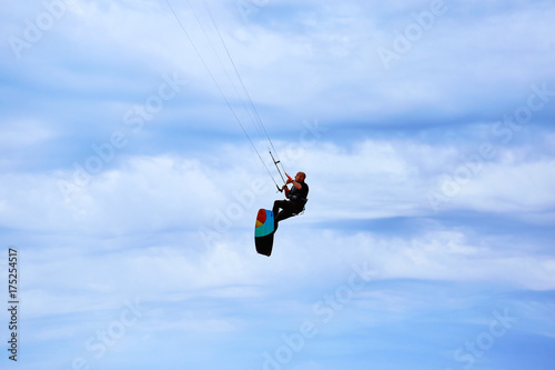 Kite Surfing on waves at sea in summer.