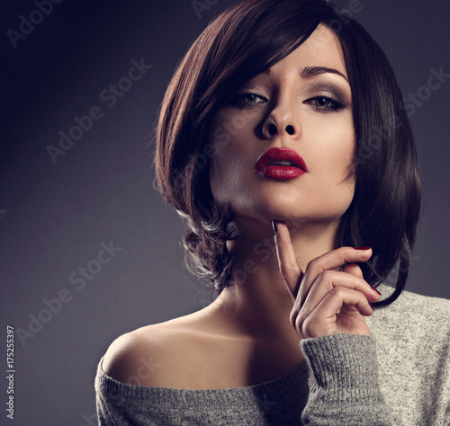 Fotografia do Stock: Portrait of a beautiful strong woman with short  haircut and make-up
