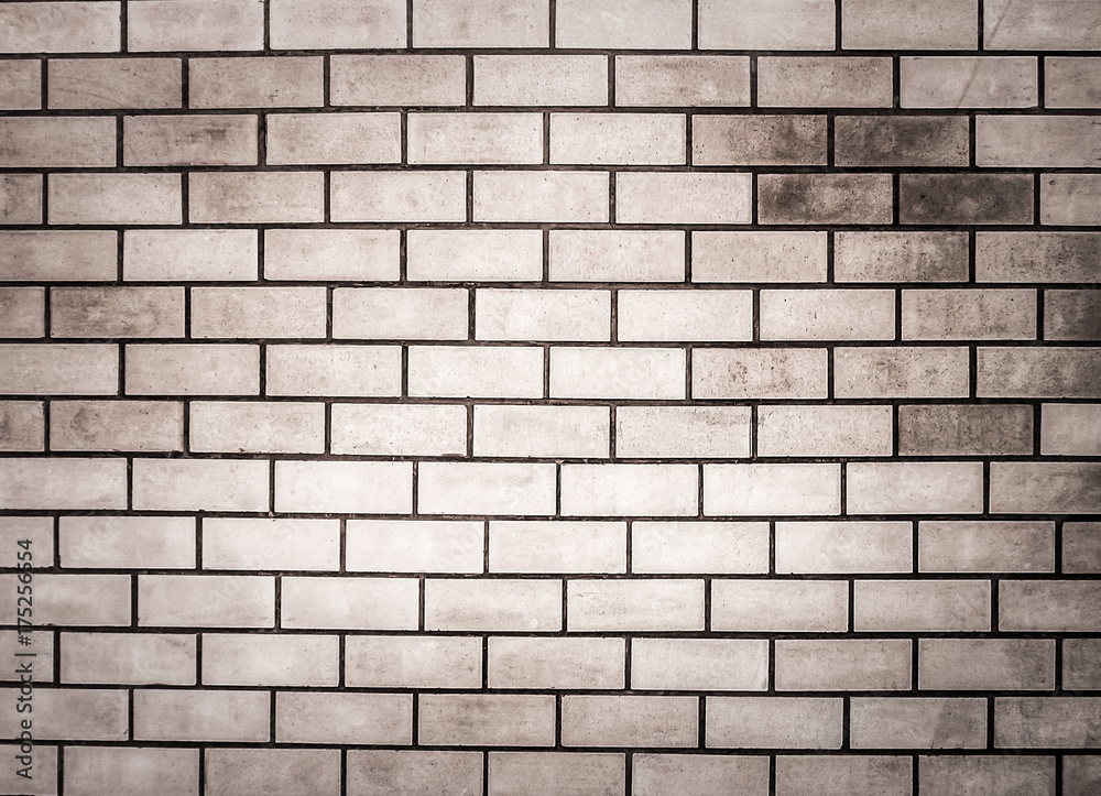 Brick wall with gray stain, light in the middle for background or wallpaper. Brick wall with gray stain, light in the middle for background or wallpaper.