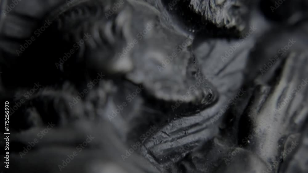 Close up shot of a statue painting, shot in studio. Close up shot of a statue painting, shot in studio.
