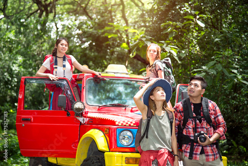 Group Trip of Young Asian Backpacker Travel with 4WD Off Road Adventure in the Forest in Thailand - Holiday Concept © Platoo Studio