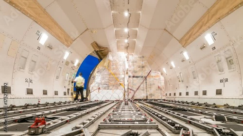 Loading air cargo freighter inside aircraft - Zoom out
