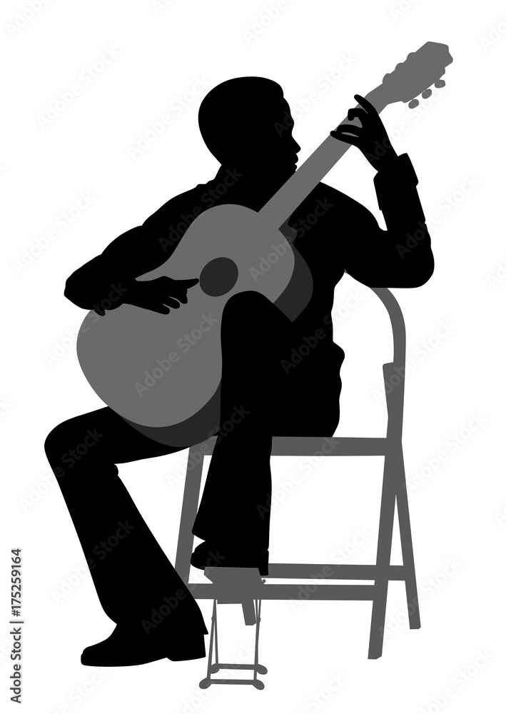 Fototapeta premium Young man playing acoustic guitar