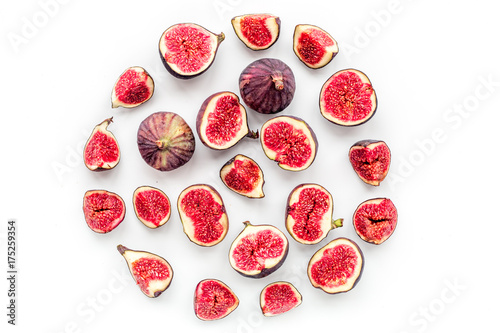 Fresh blue figs slices pattern. Round on white background top view