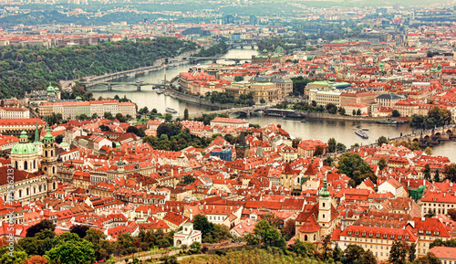 Beautiful panoramic aerial view of the Prague city from above with the old town and Vltava river. Amazing city landscape view. Vltava river from above.
