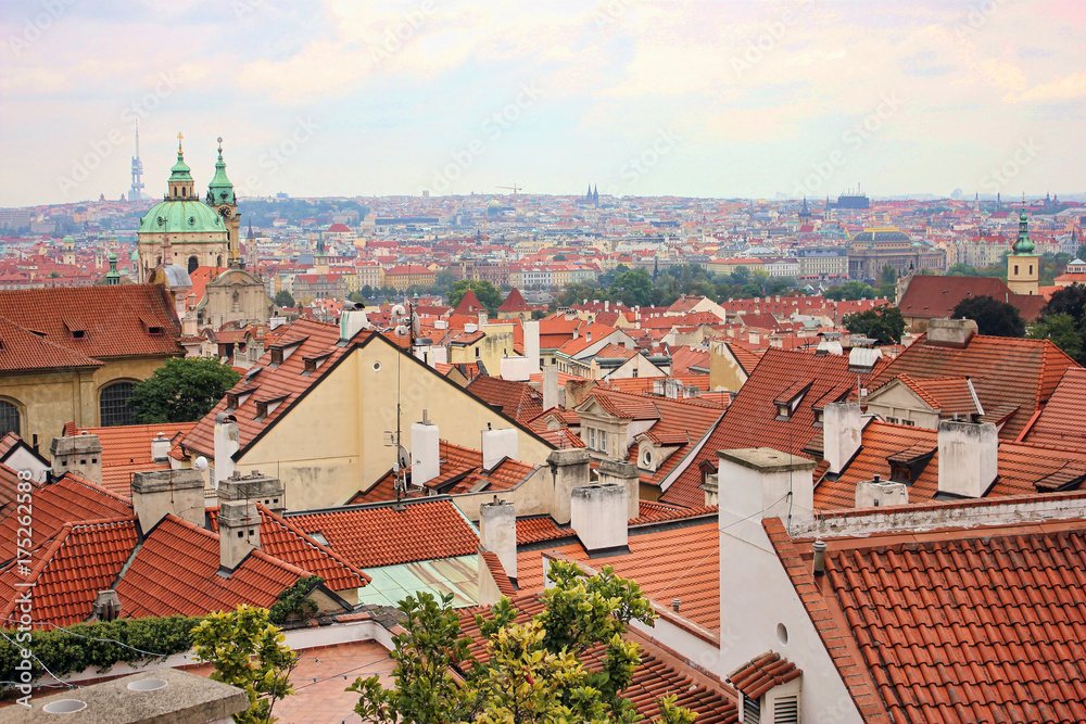Top view to red tile roofs of Prague city Czech republic. Typical Prague houses