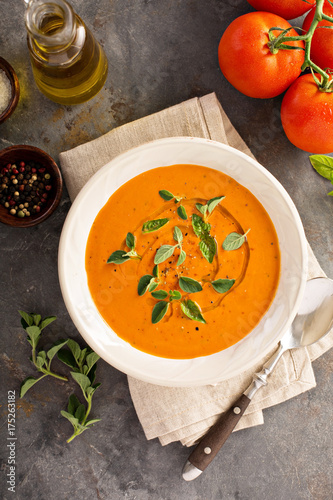 Tomato soup with olive oil and herbs
