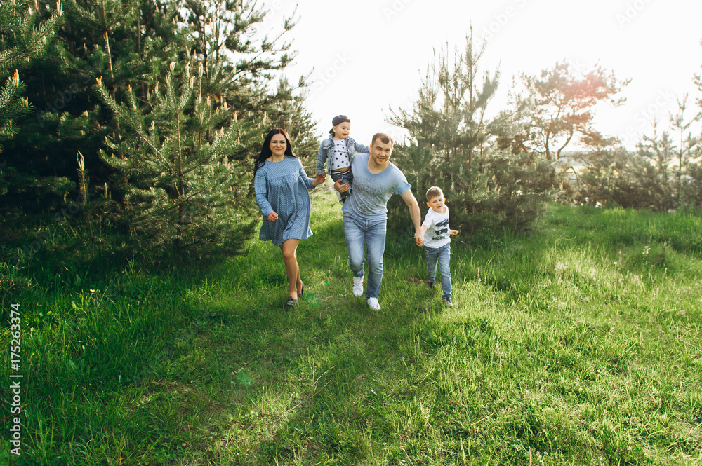 Family Dad Mom and Children in the Field