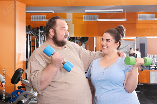 Overweight couple in gym