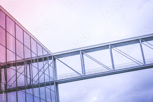 modern glass facade and steel bridge - office building exterior