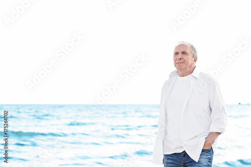 Happy senior man at sea