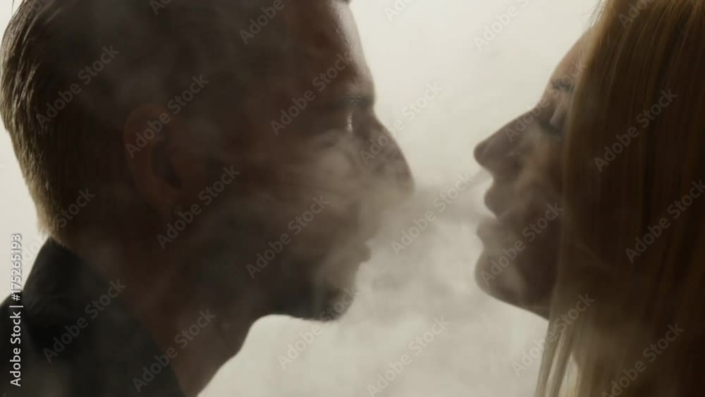 Woman gives smoke kiss to man. Vape culture Woman gives smoke kiss to man. Vape culture