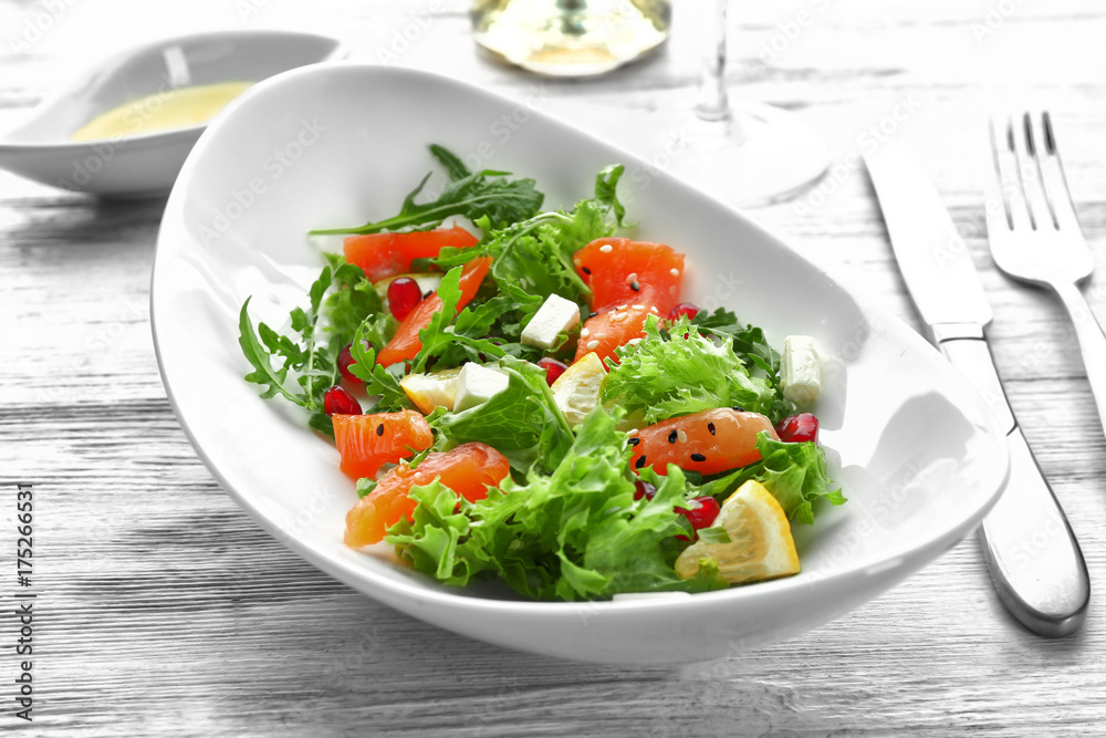 Plate with fresh salmon salad on table Plate with fresh salmon salad on table