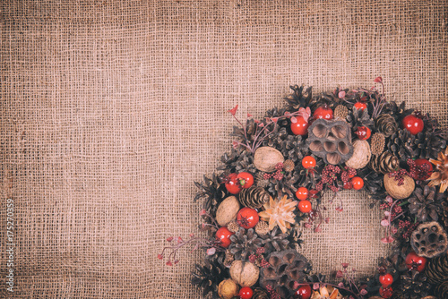 Fototapeta Naklejka Na Ścianę i Meble -  beautiful Christmas wreath on a fabric background