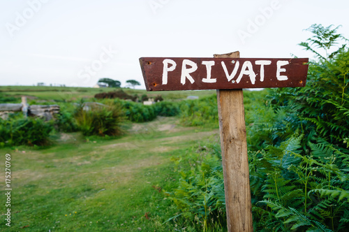 Sign saying "Private" at the start of a grassy path