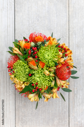 Fototapeta Naklejka Na Ścianę i Meble -  Autumn bouquet of flowers on the tiles