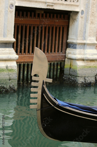 bow of the gondola with the famous metal symbol in venice during