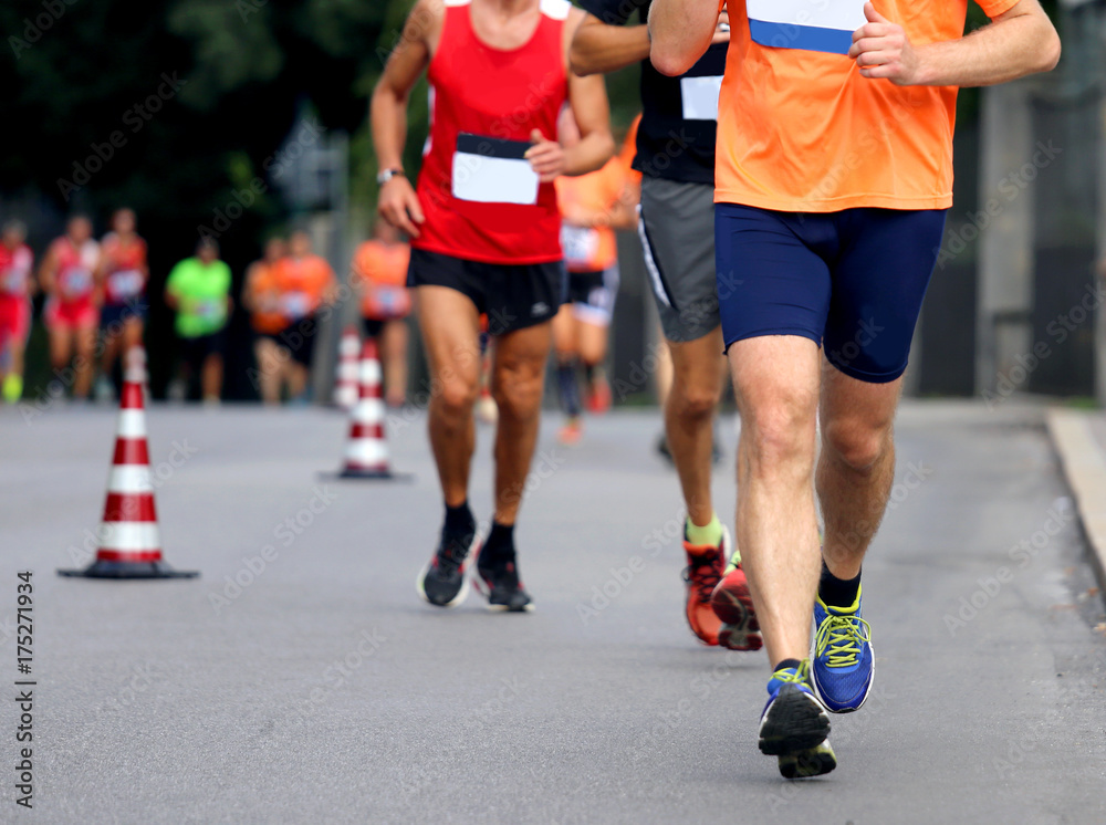 Racing and athletes in sportswear race on the roads Racing and athletes in sportswear race on the roads