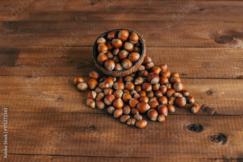 Autumn harvest. Nuts on a wooden background.