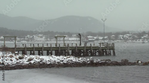 Snow falls over dock in Southwest Harbor, Maine