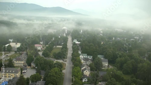 Aerial, fog rolls over Bethel, Maine