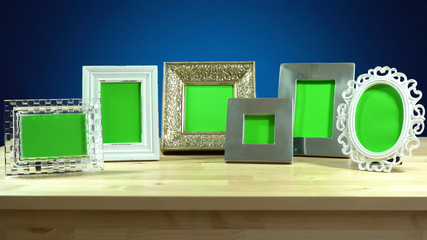 Photo frames in elegant interiors display.