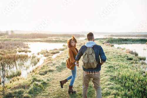 Young tourist couple at sunset sun