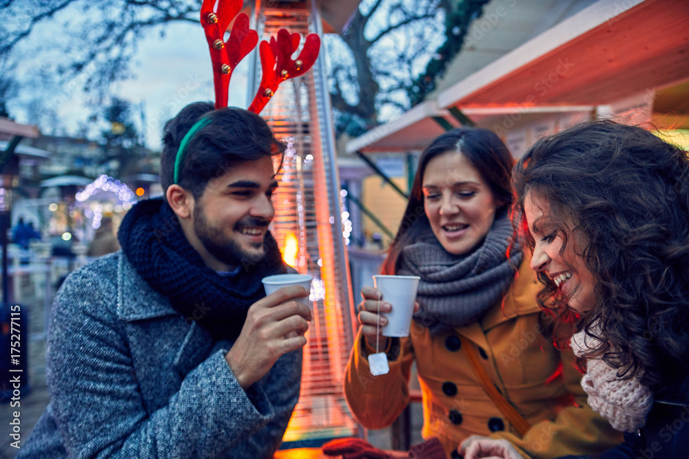 Fototapeta premium Friends On Christmas Market