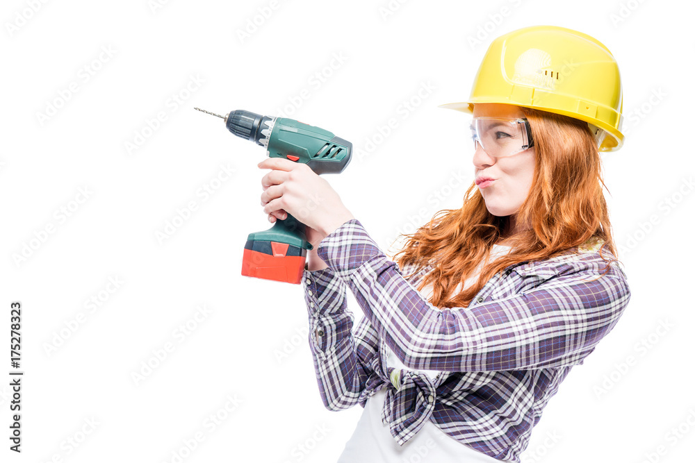 fragile girl with a man's tool on a white background, space left fragile girl with a man's tool on a white background, space left