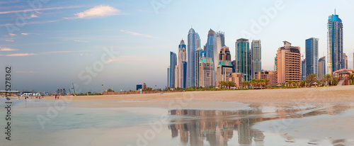 Obraz na płótnie Dubai - The Marina towers from beach in evening light.