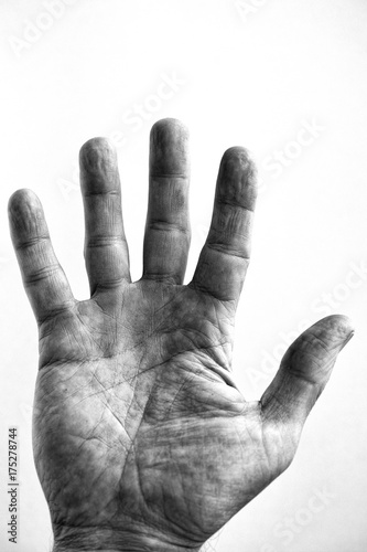 Grainy black and white of a middle aged male hand