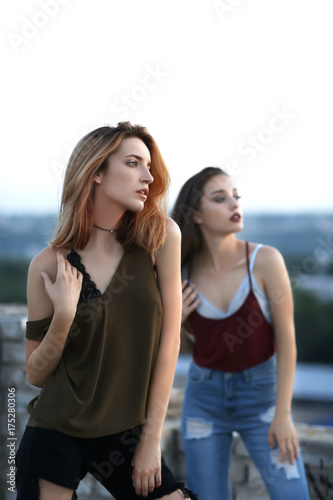 Fashionable young women out...