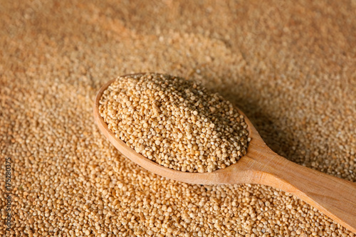 Spoon with quinoa on seeds