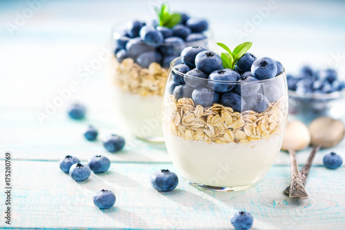 Blueberries and muesli for breakfast for two persons