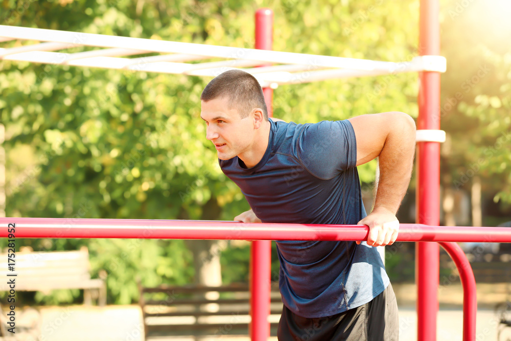 Sporty young man training outdoors Sporty young man training outdoors