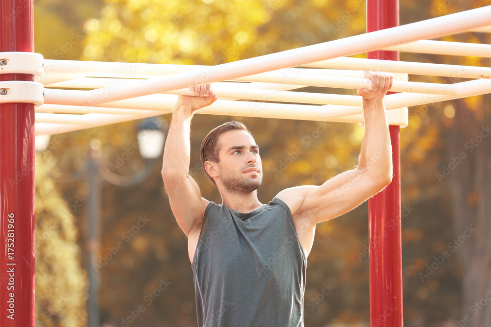 Sporty young man training outdoors Sporty young man training outdoors